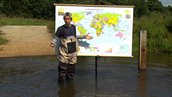 Afbeelding Het klokhuis over water